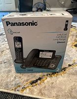 Front of Panasonic retail box showing model, features and image of phone system