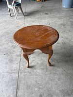 Top view showing round wooden surface with scratches