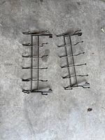 Both metal over-door racks laid flat showing full structure and hook arrangement