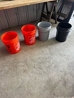 All four buckets aligned showing colors and condition
