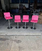All four bar stools lined up showing overall condition and design