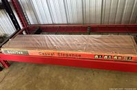 Full view of sealed SoniTex Casual Elegance laminate flooring box on shelf