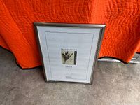 Front view showing silver metal frame and insert indicating 18 x 24 size