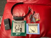 Overview of all components including transmitter, collar, antenna, screwdriver, hardware bag, manuals