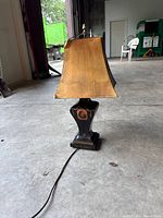 Full view of lamp showing base, cord, and square-bell shade