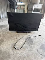 Front view of Vizio 32-inch TV with power cord