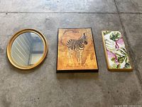 Overview of mirror, zebra art, and flamingo tray