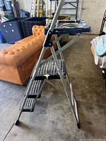 Side view of Werner 3-step ladder showing frame and steps