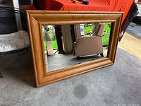 Front view of rectangular wood frame mirror