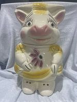 Front view showing dress side with flower