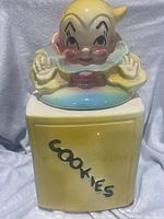Front view showing entire cookie jar with COOKIES lettering and clown lid