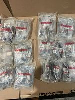 Multiple Richelieu polybags containing cabinet hardware on box