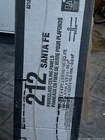 Label showing model 212 Santa Fe and dimensions