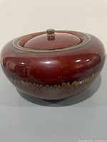 Overall view of lidded ceramic fire pot