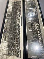 Both long framed photographs side by side showing overall size and frames