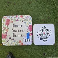 Both wall signs side by side for size comparison