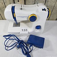 Full view of Ikea SY sewing machine and blue foot pedal
