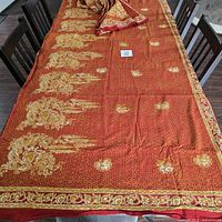 Full view of unfolded batik fabric on table