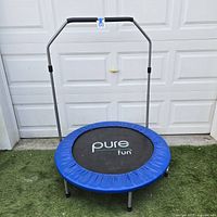 Full view of Pure Fun mini trampoline showing handle and frame