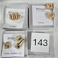 Overview of all wooden and plastic game tiles in four compartments