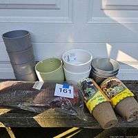 Group shot of all pots, liners and peat pots