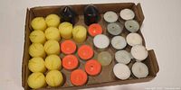 Top view of entire box showing all candles grouped by color and type