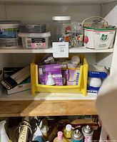 Shelf with compound tub, organizer case, nails box, jars of hardware, produce basket