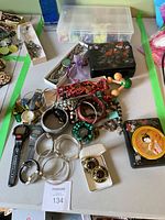 Overview of jewelry, watches, bangles, storage boxes and tins