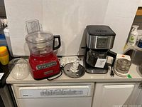 All three appliances on countertop with accessories visible