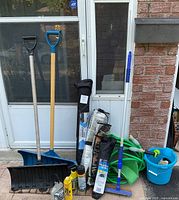Full lot showing snow shovels, chair bag, hose, bucket