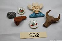 Group shot of all six neckerchief slides