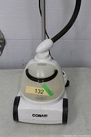 Close view of Conair steamer base, water tank, wheels