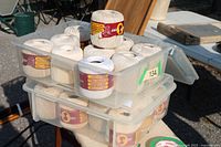 Two bins stacked containing multiple spools of South Maid crochet thread