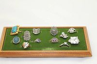 All twelve rings on green felt display