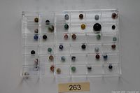 Full view of tray holding 36 assorted marbles