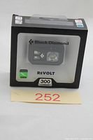 Front of sealed retail box showing Black Diamond ReVolt headlamp and 300 lumens rating