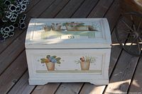 front view of painted wooden trunk