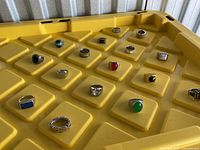 Overview of 18 rings on yellow bin lid