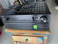 Front and top view of Onkyo TX-NR525 receiver with power cord