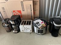 Line-up of all five appliances on floor