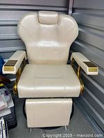 Front view of cream vinyl spa chair with footrest extended