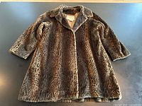 Full front view of faux leopard fur coat