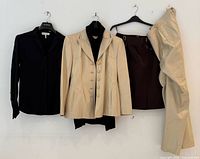 Group shot of all five Escada garments on hangers
