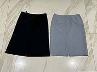 Black and grey Prada skirts laid flat front view