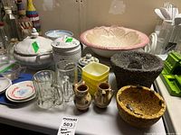 Overview of tureen, canister, mortars, bowls, glasses, saucers, pitchers and other pieces