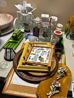 overview of lot showing kitchen utensils, grinders, glass jars, decor items on table