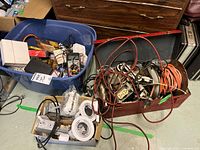 Overview of blue tote, red toolbox, pot lights and cords