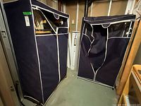 Two navy fabric closets side by side in basement storage area