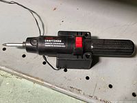 Craftsman cordless screwdriver on charger base