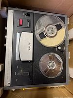 Top view of Sony TC-230 tape recorder showing reels and control panel